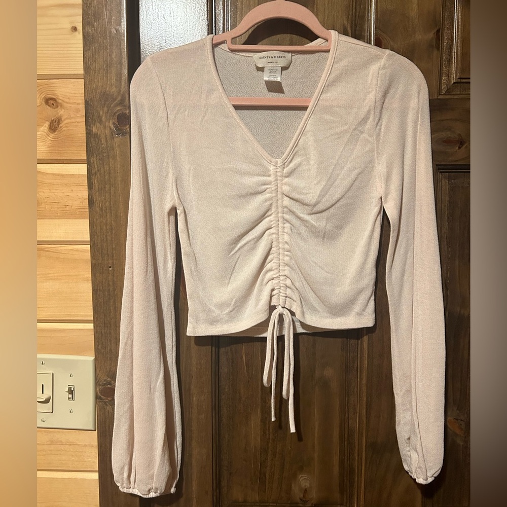 Cream long sleeve blouse.